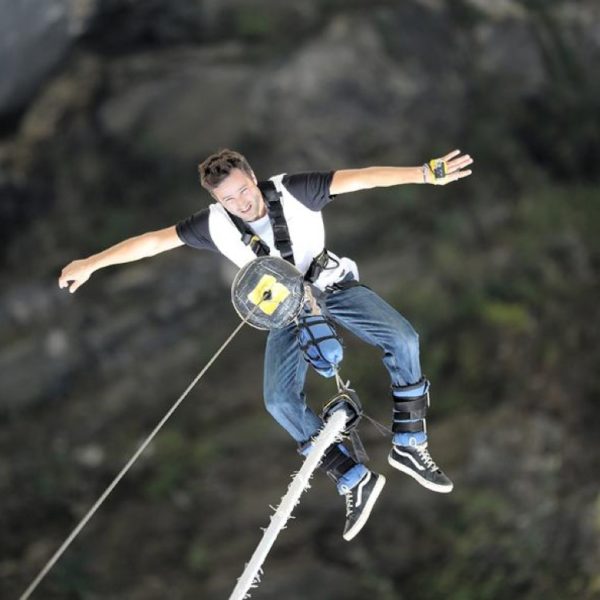 Winching after a bungee jump from the Verzasca dam in Ticino